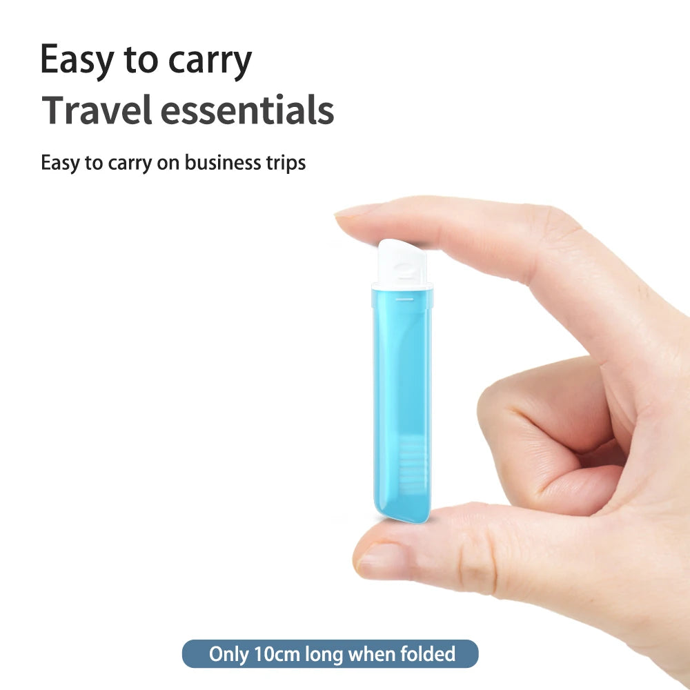 Compact mini travel toothbrush shown in hand for size reference